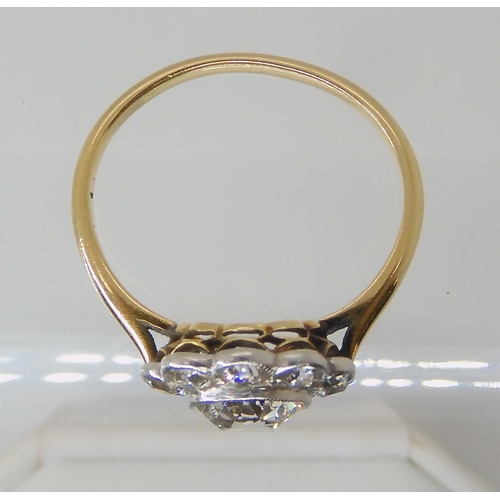 651 - AN OLD CUT DIAMOND SET FLOWER RING