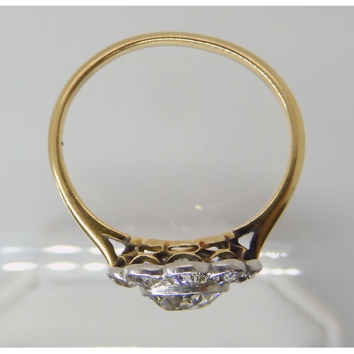 651 - AN OLD CUT DIAMOND SET FLOWER RING
