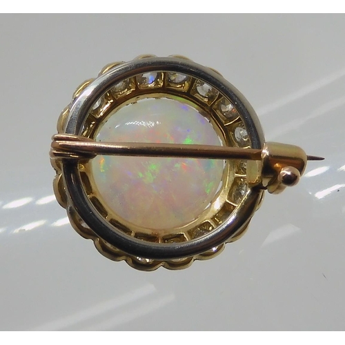 654 - AN OPAL AND DIAMOND BROOCH