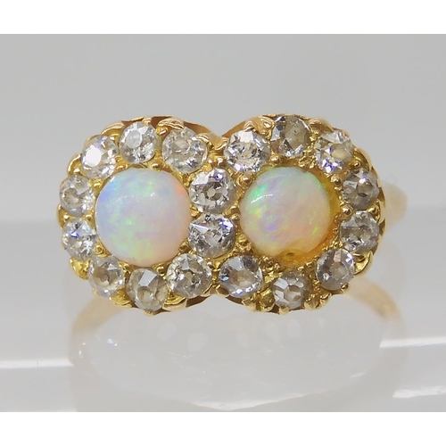 657 - A BRIGHT YELLOW METAL OPAL AND DIAMOND RING