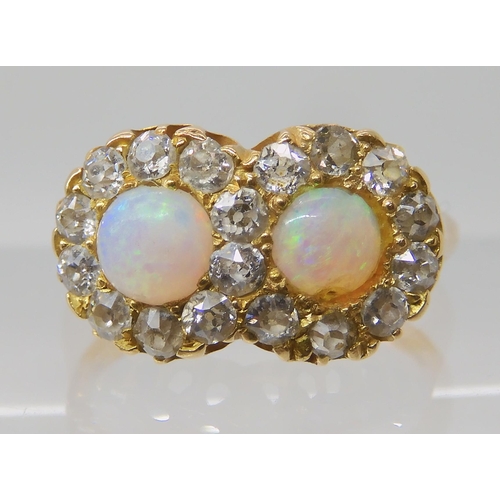 657 - A BRIGHT YELLOW METAL OPAL AND DIAMOND RING