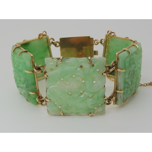 659 - A 9CT GOLD MOUNTED CHINESE GREEN HARDSTONE BRACELET