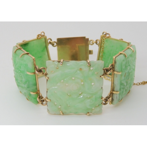 659 - A 9CT GOLD MOUNTED CHINESE GREEN HARDSTONE BRACELET