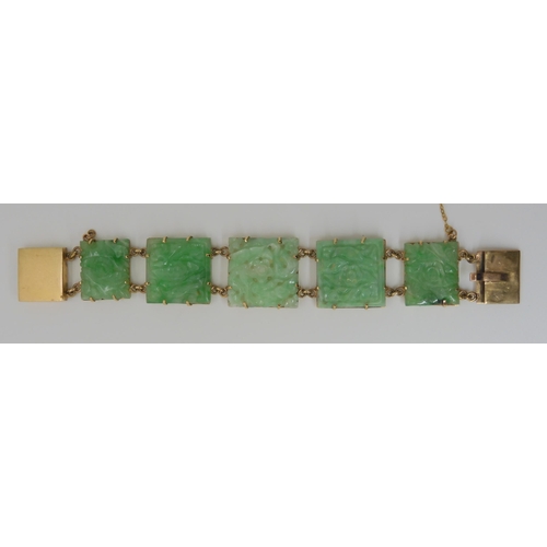 659 - A 9CT GOLD MOUNTED CHINESE GREEN HARDSTONE BRACELET