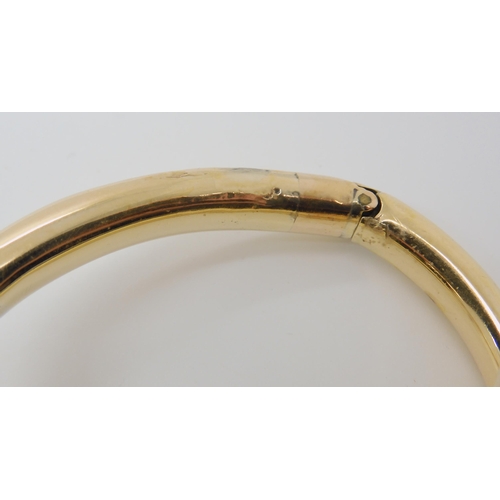 661 - A YELLOW METAL VICTORIAN ARTICULATED SNAKE BANGLE