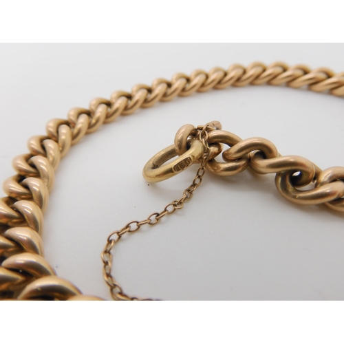 667 - A 15CT GOLD CURB LINK BRACELET