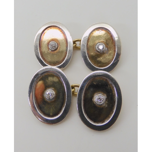 669 - A PAIR OF 18C YELLOW AND WHITE GOLD CUFFLINKS SET WITH DIAMONDS