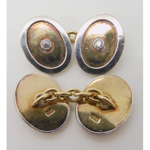 669 - A PAIR OF 18C YELLOW AND WHITE GOLD CUFFLINKS SET WITH DIAMONDS