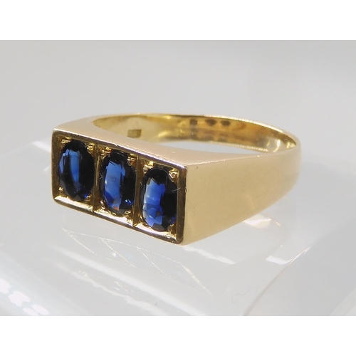 674 - A 14K GOLD GENTS THREE SAPPHIRE RING