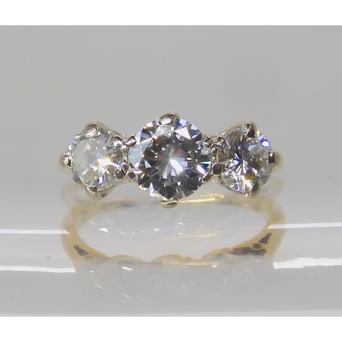 675 - AN 18CT GOLD THREE STONE DIAMOND RING