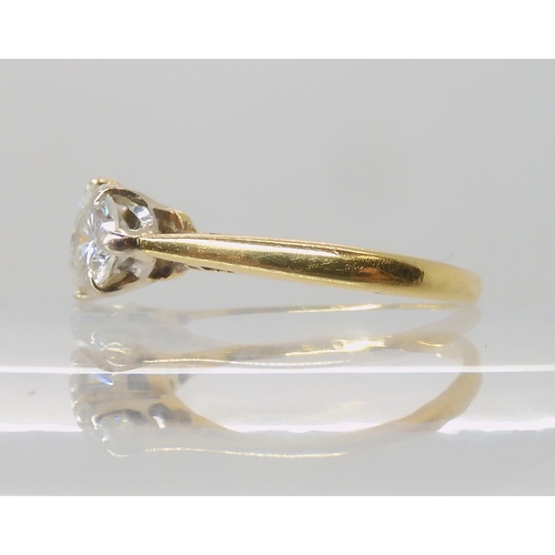 675 - AN 18CT GOLD THREE STONE DIAMOND RING