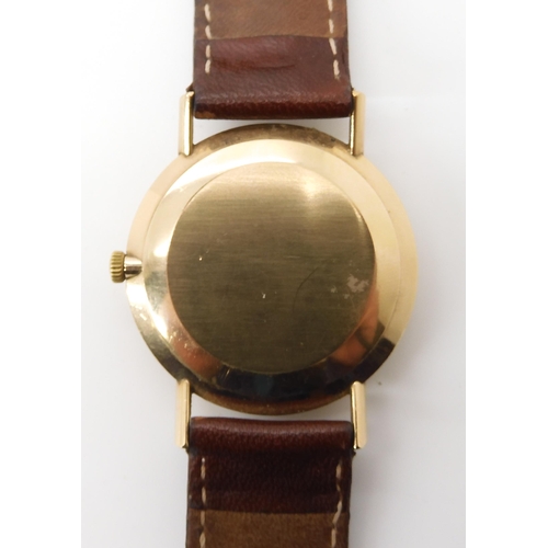 699 - A 9CT GOLD CASED OMEGA