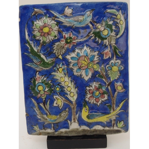 106 - AN ISNIK RELIEF MOULDED POTTERY TILE