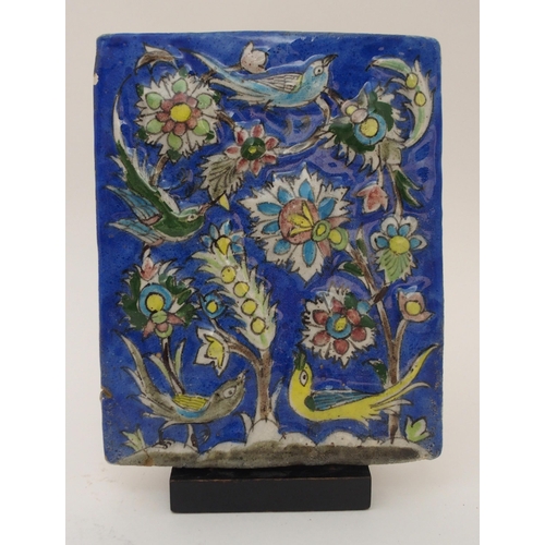 106 - AN ISNIK RELIEF MOULDED POTTERY TILE