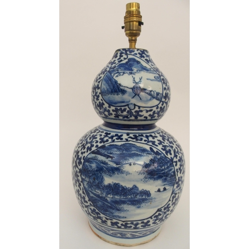 115A - A CHINESE BLUE AND WHITE DOUBLE GOURD VASE