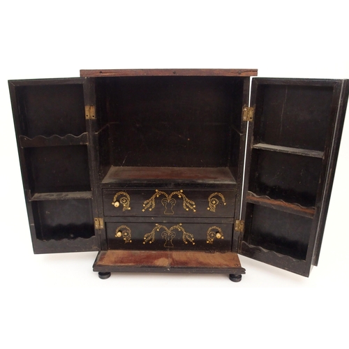 116 - AN ANGLO INDIAN EBONY TABLE CABINET