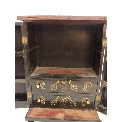 116 - AN ANGLO INDIAN EBONY TABLE CABINET