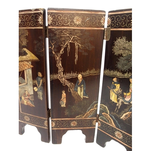 116A - A CHINESE LACQUERED FOUR-FOLD TABLE SCREEN