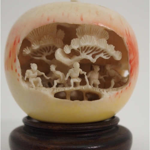 74 - A CHINESE CARVED APPLE