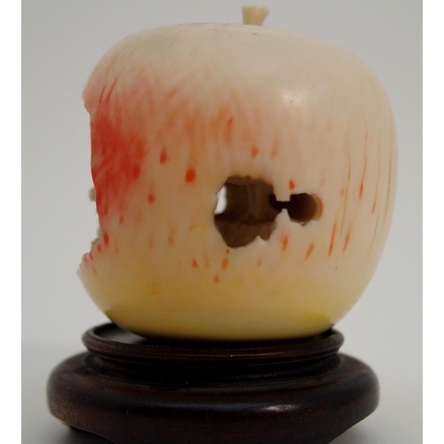 74 - A CHINESE CARVED APPLE