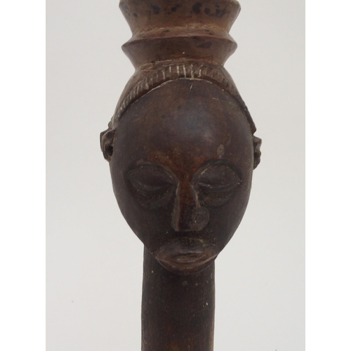 93 - AN AFRICAN CARVED AND STAINED CARVING