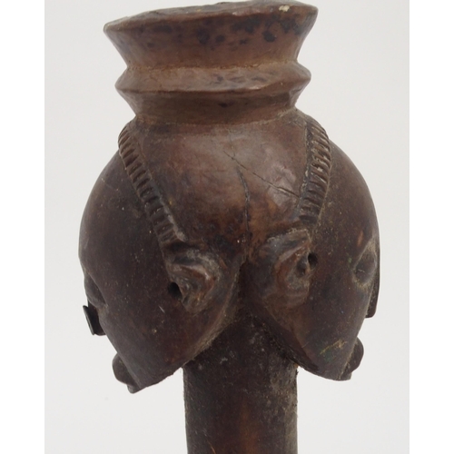 93 - AN AFRICAN CARVED AND STAINED CARVING