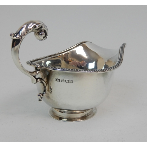 167 - A SILVER CREAM JUG