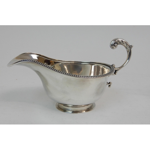 167 - A SILVER CREAM JUG