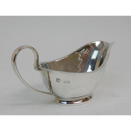 167 - A SILVER CREAM JUG