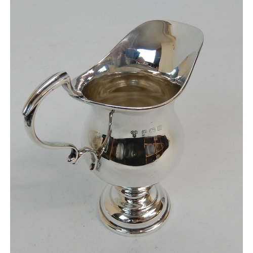 167 - A SILVER CREAM JUG