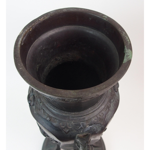 33 - AN ASIAN BRONZE TWO-HANDLED VASE