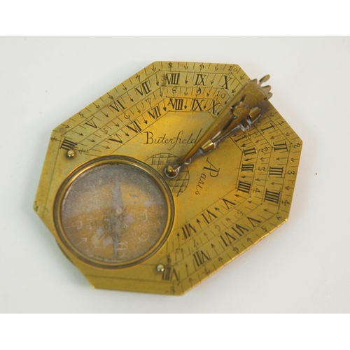 331 - AN 18TH CENTURY FRENCH BRASS OCTAGONAL FOUR-SCALE POCKET COMPASS AND SUNDIAL