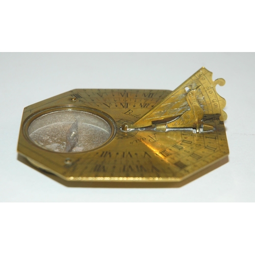 331 - AN 18TH CENTURY FRENCH BRASS OCTAGONAL FOUR-SCALE POCKET COMPASS AND SUNDIAL