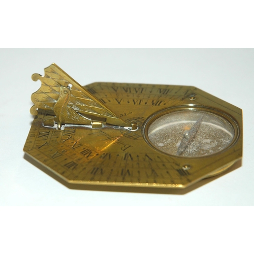 331 - AN 18TH CENTURY FRENCH BRASS OCTAGONAL FOUR-SCALE POCKET COMPASS AND SUNDIAL