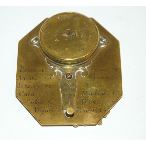 331 - AN 18TH CENTURY FRENCH BRASS OCTAGONAL FOUR-SCALE POCKET COMPASS AND SUNDIAL