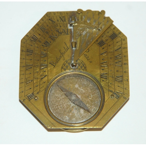 331 - AN 18TH CENTURY FRENCH BRASS OCTAGONAL FOUR-SCALE POCKET COMPASS AND SUNDIAL