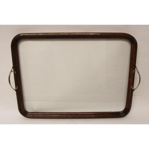 368 - AN EDWARDIAN OAK FRAMED TWO-HANDLED TEA TRAY