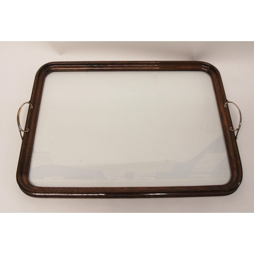 368 - AN EDWARDIAN OAK FRAMED TWO-HANDLED TEA TRAY