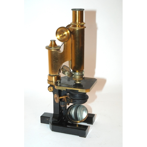 374 - A LACQUERED BRASS AND BLACK ENAMEL CARL ZEISS JENA MICROSCOPE