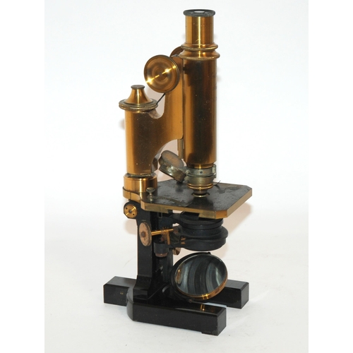 374 - A LACQUERED BRASS AND BLACK ENAMEL CARL ZEISS JENA MICROSCOPE