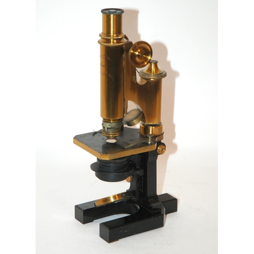 374 - A LACQUERED BRASS AND BLACK ENAMEL CARL ZEISS JENA MICROSCOPE