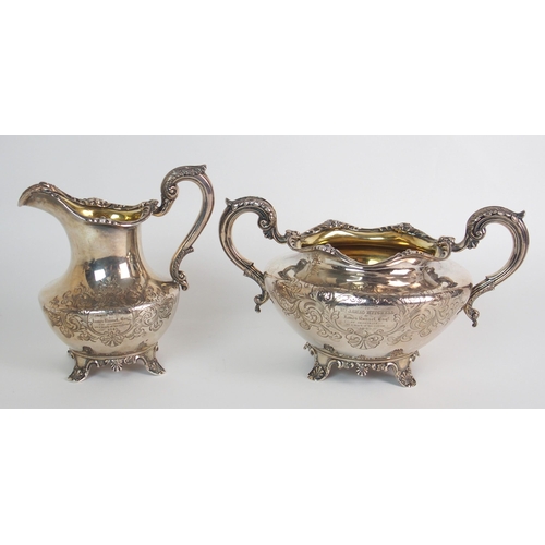 151 - A PAIR OF GERMAN SILVER MOUNTED CUT GLASS CLARET JUGS