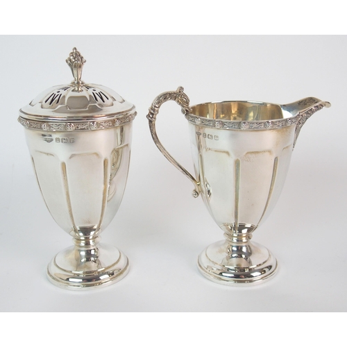 212 - A FOUR PIECE SILVER TEA SERVICE