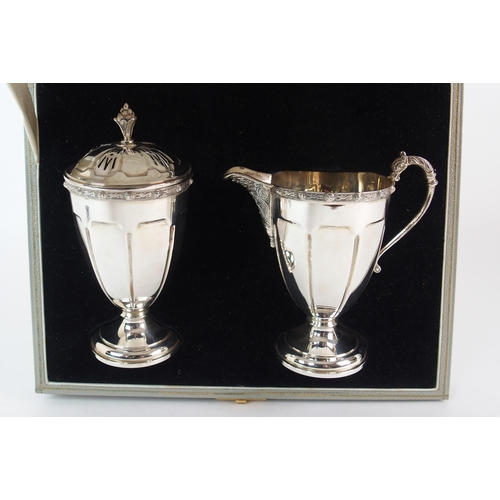 212 - A FOUR PIECE SILVER TEA SERVICE