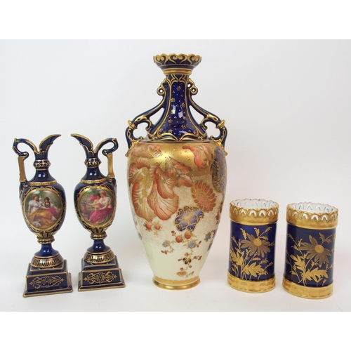 599 - A PAIR OF ROYAL WORCESTER TWO-HANDLED JARS AND COVERS