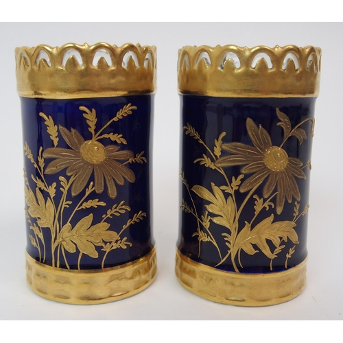 599 - A PAIR OF ROYAL WORCESTER TWO-HANDLED JARS AND COVERS