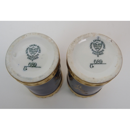 599 - A PAIR OF ROYAL WORCESTER TWO-HANDLED JARS AND COVERS