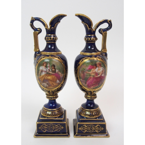 599 - A PAIR OF ROYAL WORCESTER TWO-HANDLED JARS AND COVERS