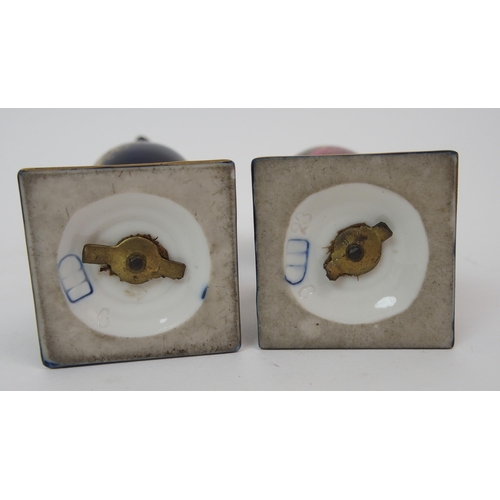 599 - A PAIR OF ROYAL WORCESTER TWO-HANDLED JARS AND COVERS