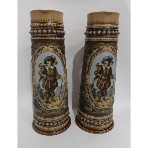 104 - A PAIR OF LARGE METTLACH EWERS